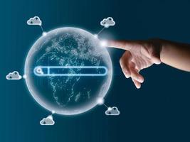 The human finger points to the world model. Displays data transfers around the world. The global cloud system, the global Internet system, communication. photo