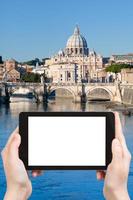 tourist photographs of bridge on Tiber river, Rome photo