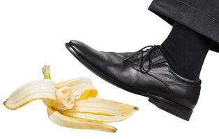 leg in the left black shoe slips on a banana peel photo