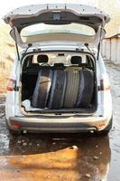 set of tires in boot of car photo
