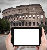 tourist photographs of Coliseum in Rome photo