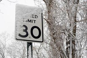 road sing under snow in USA photo