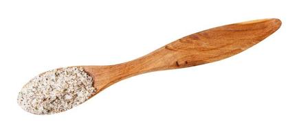 top view of wooden salt spoon with seasoned salt photo