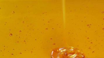 Close up shot of honey being poured. Full screen honey background. video
