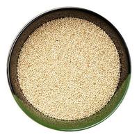top view of amaranth grains in round bowl isolated photo