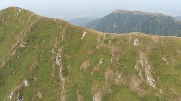 Aerial static top view group of four hikers hike on Lagodekhi national park black rock trail back video