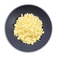 top view moroccan couscous in gray bowl isolated photo