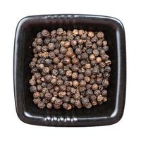 hainan black pepper in black bowl isolated photo