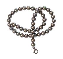 tangled necklace from black pearls isolated photo