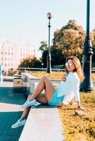 Young girl on the city street photo