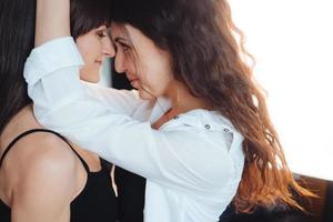 Two girls in each other's tender embraces photo