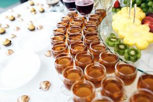 Rich buffet, whiskey, bourbon, champagne, wine and fruit. photo