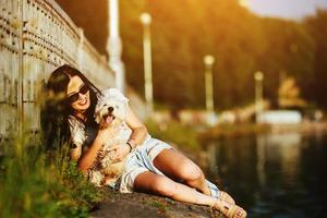 girl with a dog on the lake photo