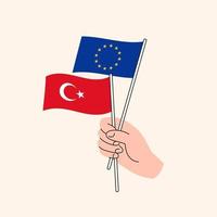 Cartoon Hand Holding European Union And Turkish Flags. EU Turkey Relationships. Concept of Diplomacy, Politics And Democratic Negotiations. Flat Design Isolated Vector