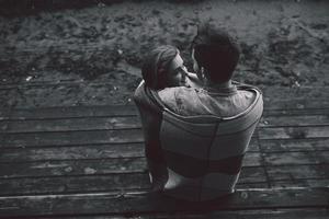 Young couple wrapped in plaid photo