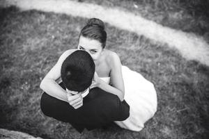 bride and groom embracing each other photo