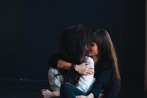 Two girls in each other's tender embraces photo