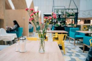 Blur restaurant, on the table is a flower photo