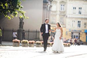 Beautiful couple walking on the European city photo