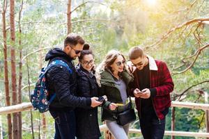Four tourists trying to find the way photo