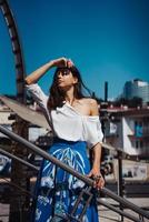 Young pretty woman on the pier near photo