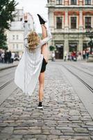 beautiful young girl lifted her leg up photo