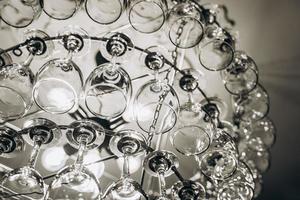 Beautiful chandelier made with glasses of wine photo