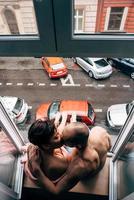 Man and beautiful girl while sitting by the window photo