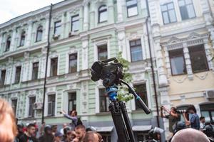 Correspondent takes photo during the Gay Pride parade