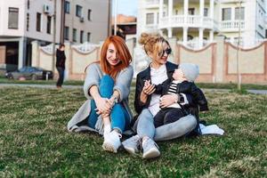 Mom and aunt play with a boy in the Park photo