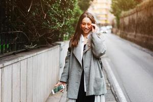 Beautiful young girl on a narrow street. photo