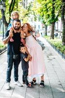 Happy beautiful family walking in the park photo