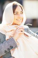 girl in a coat on the street photo