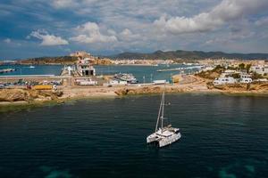 Aerial view on catamaran and port on the background. photo