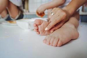 the legs of a small child in the flour photo