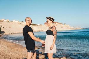 Couple in love embracing each other on beach photo