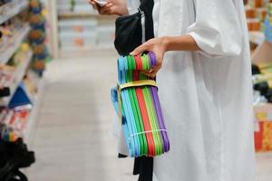 Female hand holding a set of hangers photo