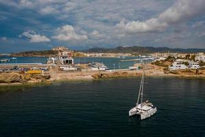 Aerial view on catamaran and port on the background. photo