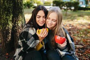 two beautiful in the park, posing for the camera photo