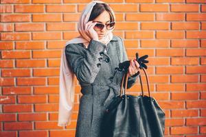 girl in a coat on the street photo