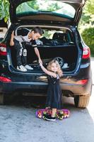 Boy and girl playing in the car photo