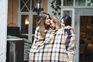 Three girlfriends on the veranda photo