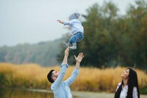 Dad throws up his young son photo