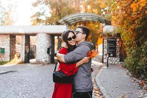 Couple in love walking in the autumn streets photo