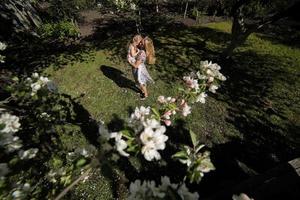 mother twist daughter in the garden photo