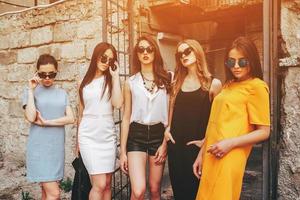 Five young beautiful girls in the city photo