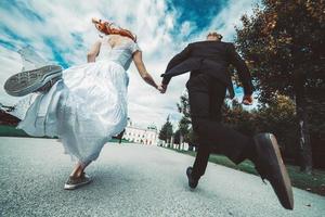 Wedding couple on a walk in the estate of the Belvedere in Vienna photo