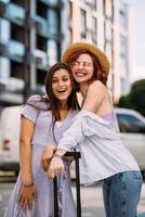 Two young women on the city street photo