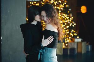 Two girls in each other's tender embraces photo