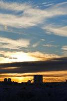 yellow winter early sunrise over urban house photo